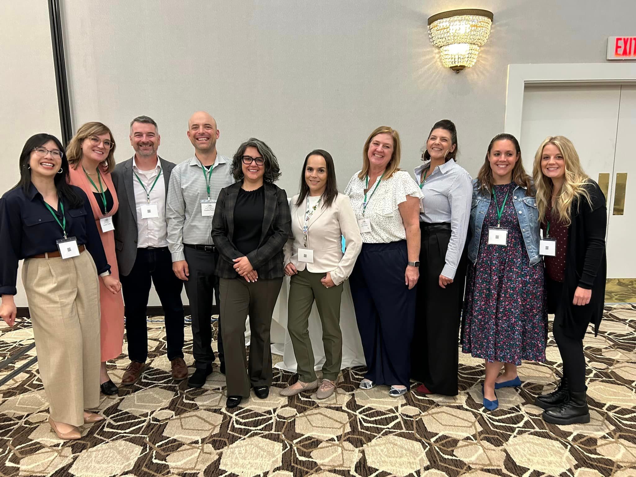 A group photo of FirstSteps staff at a conference