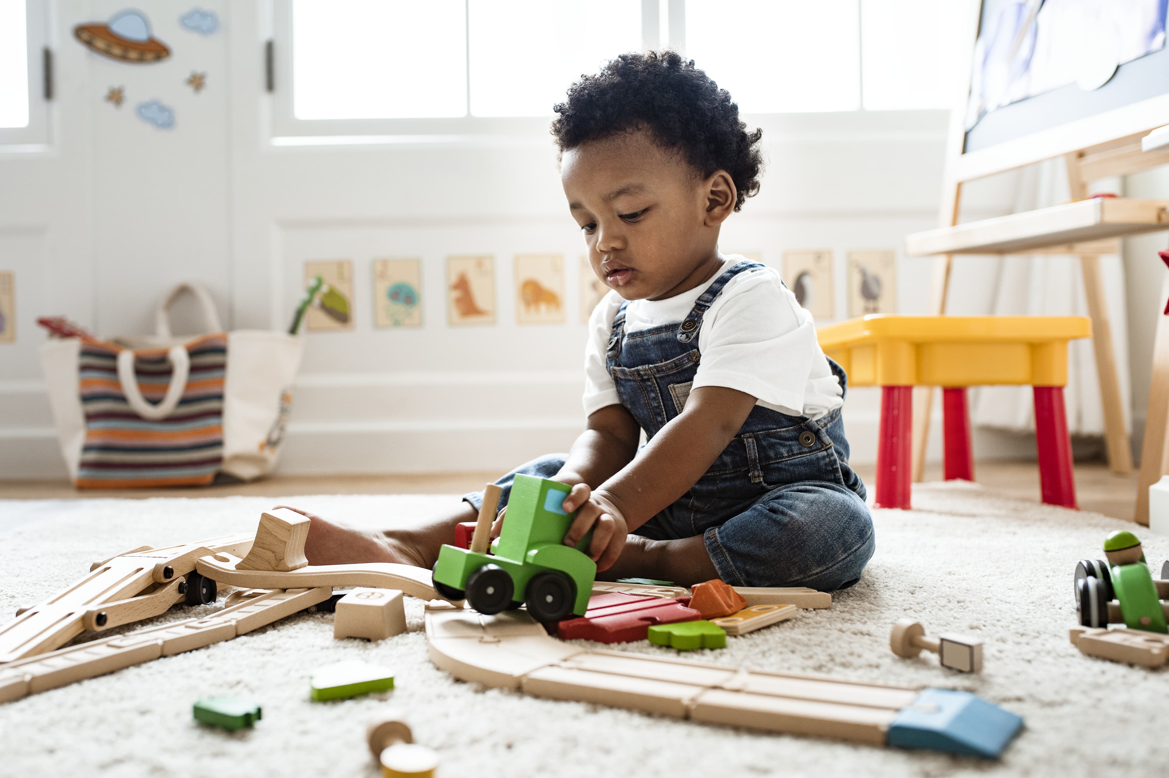 Child playing with a toy truck