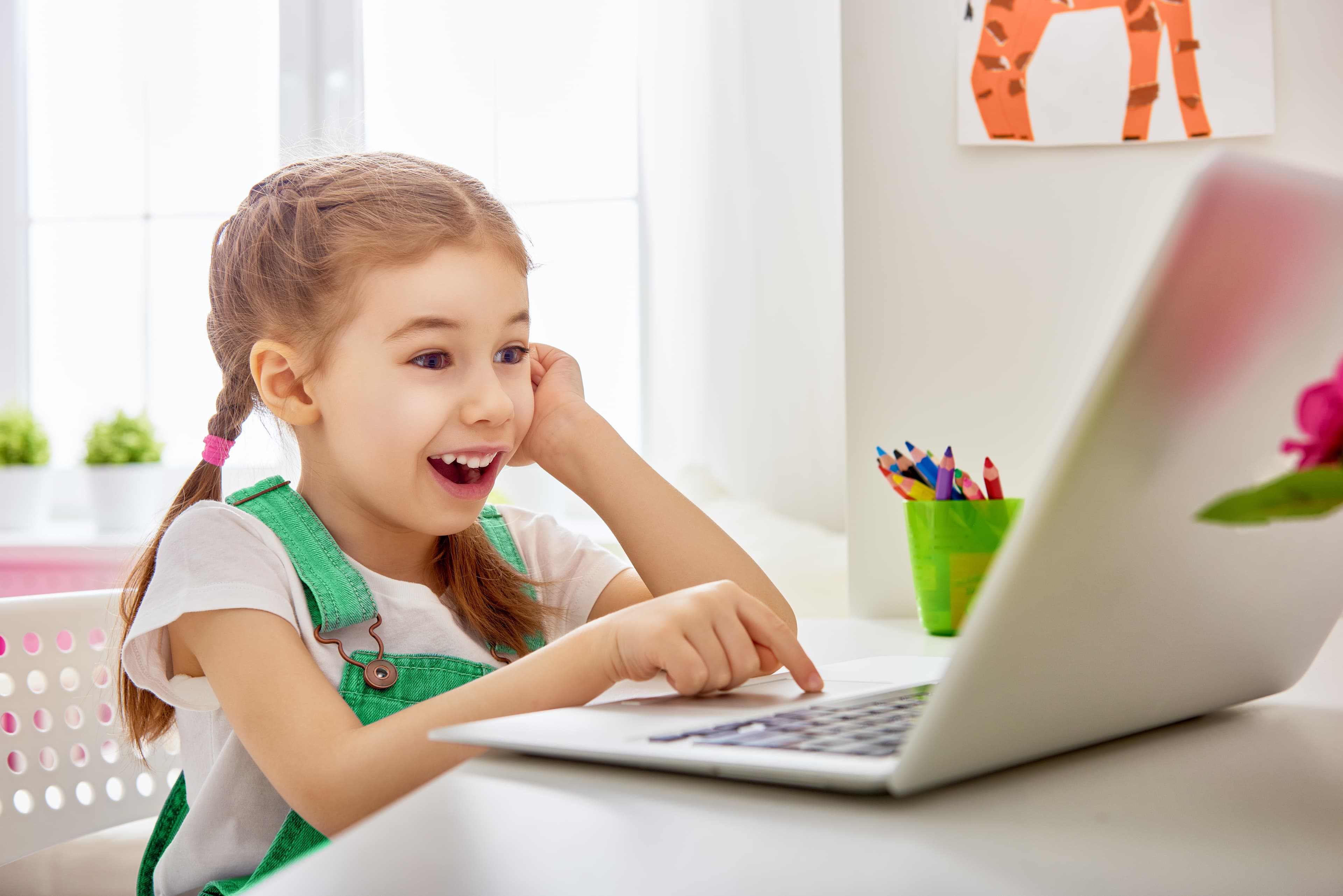 A girl using the touchpad on a laptop