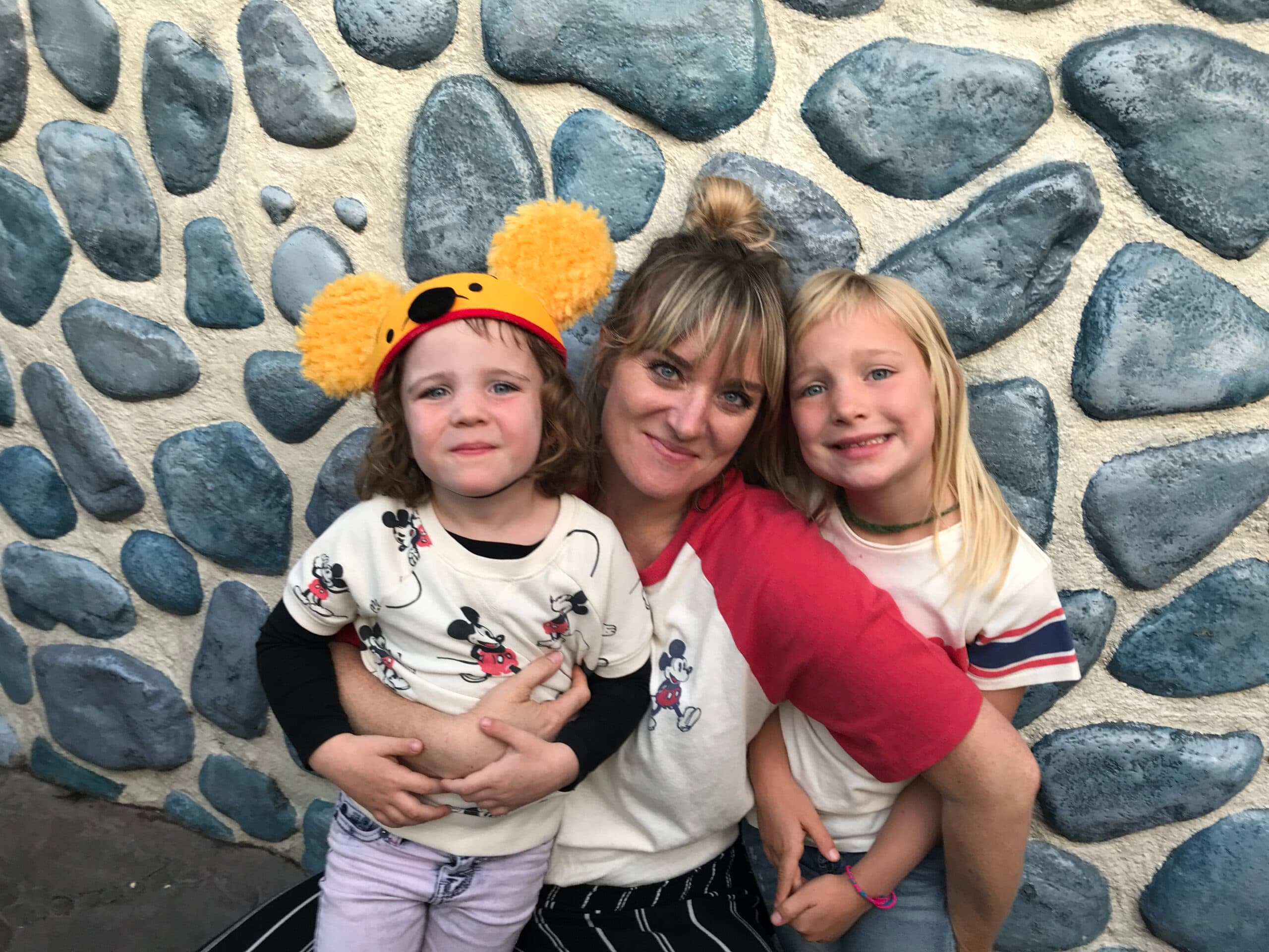 First Steps for Kids Chief Clinical Officer Courtney Tarbox sitting with child