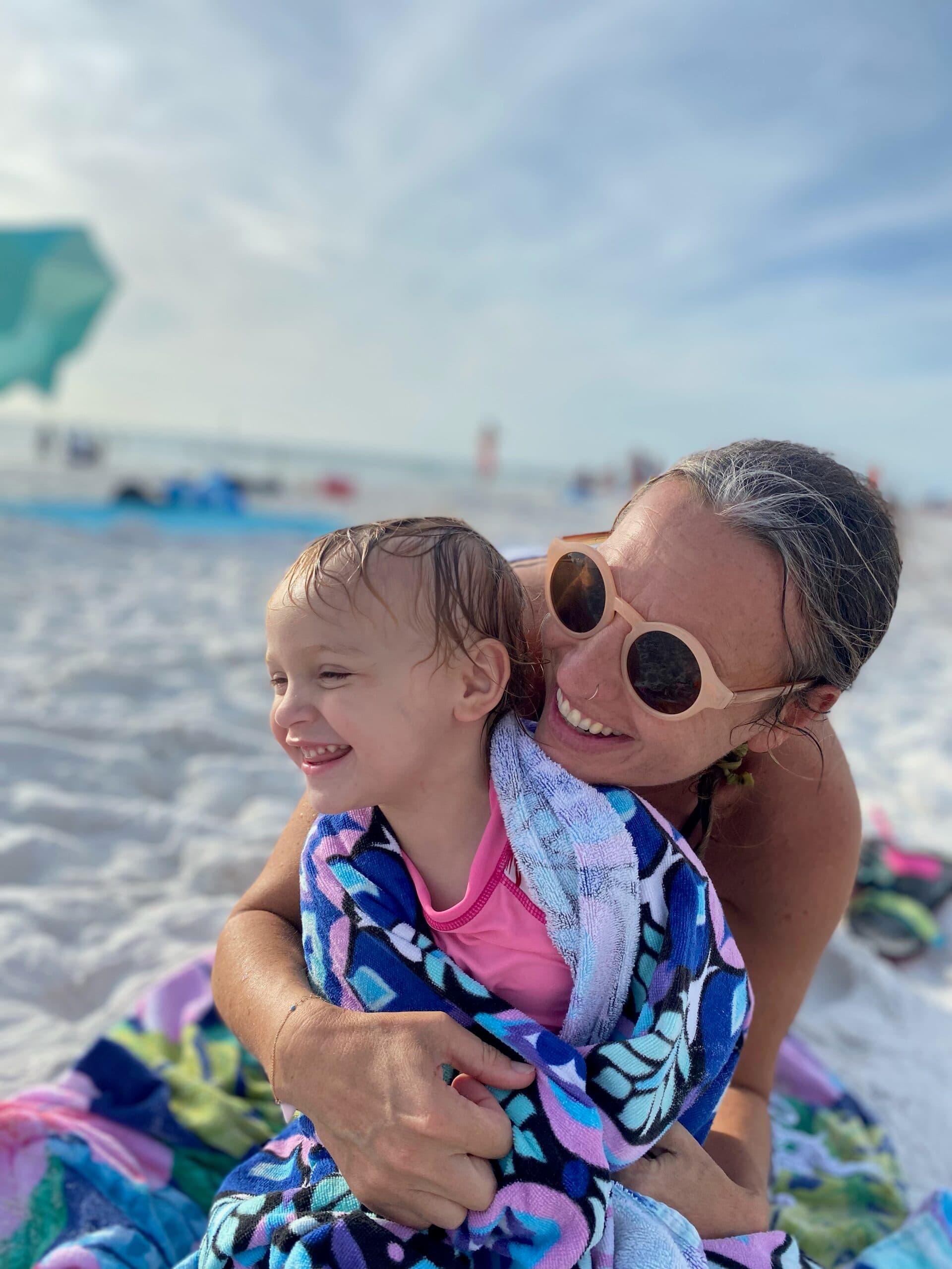 First Steps for Kids Director of Professional Development Kate Nasuti and child at the beach