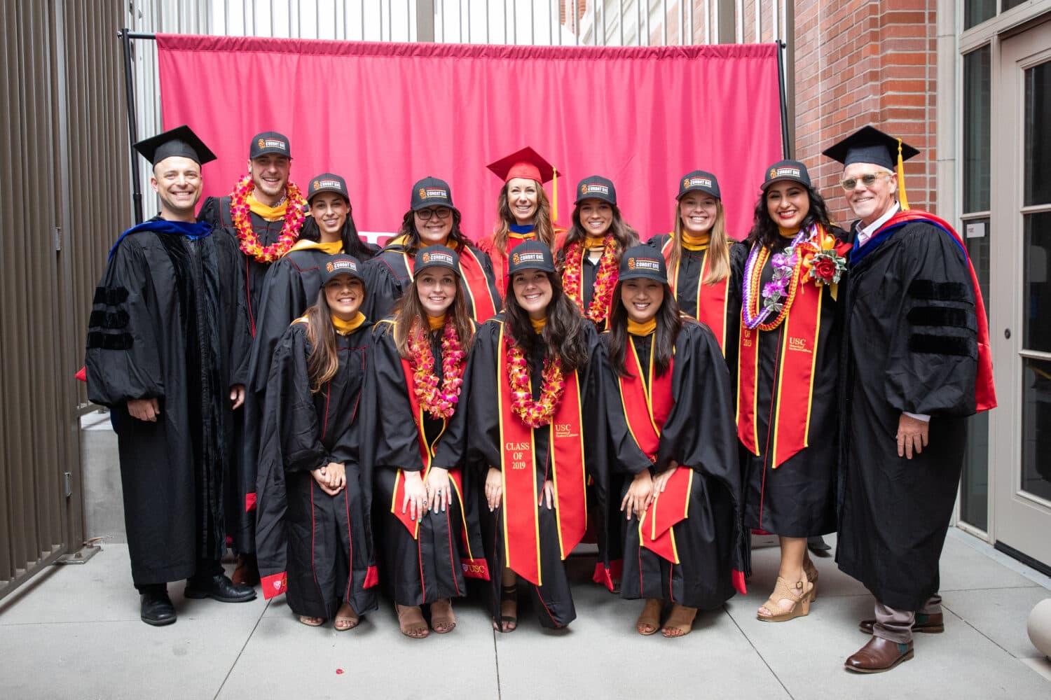 FirstSteps staff in a group photo of USC graduates