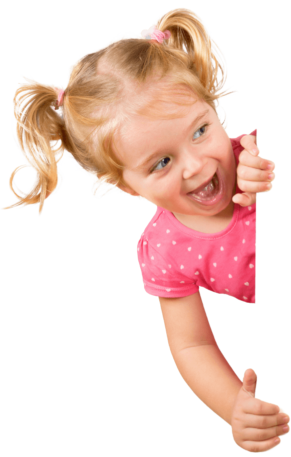 A girl looking around a corner and smiling