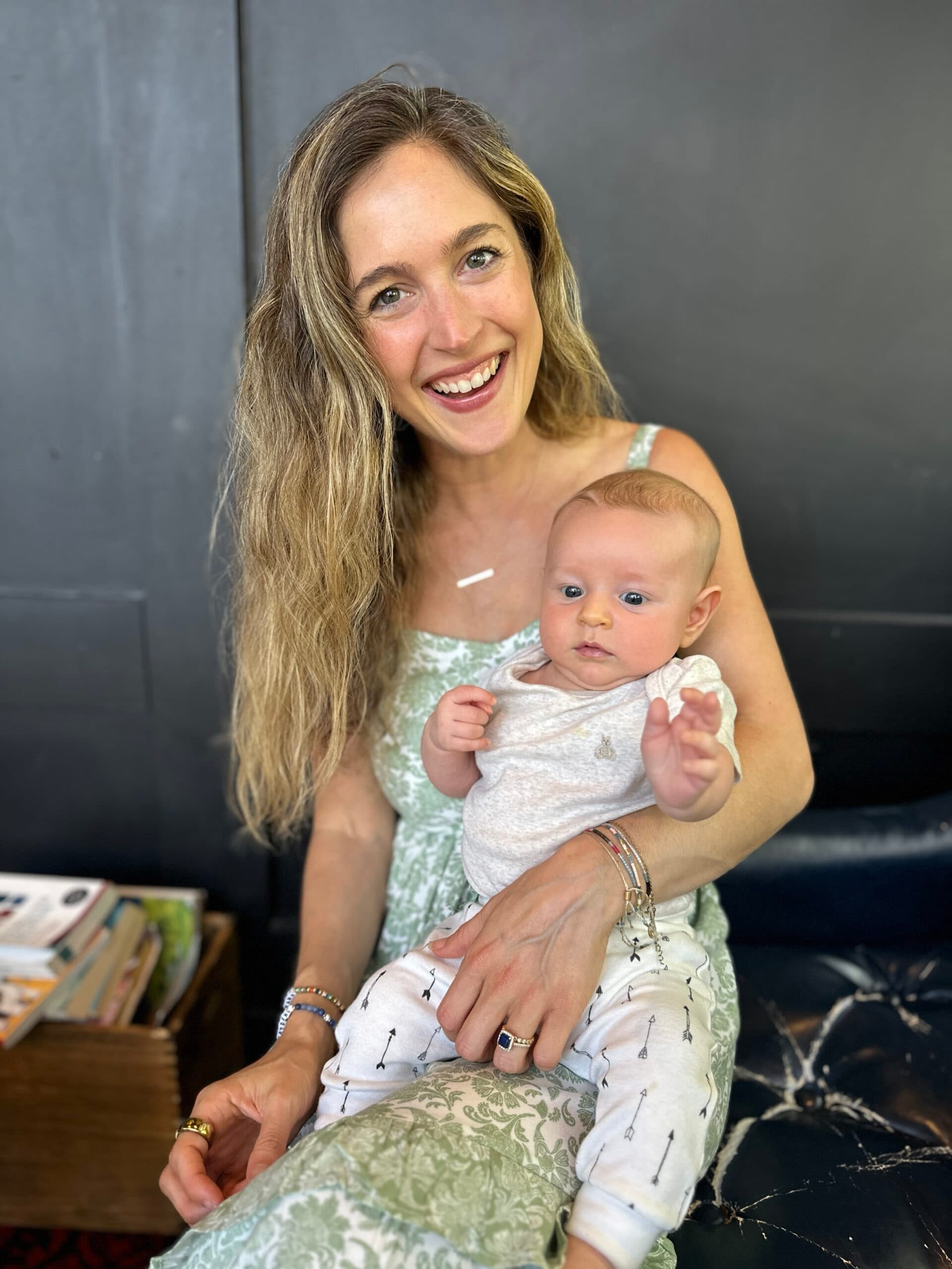 West Los Angeles Director Erica Baron holding an infant
