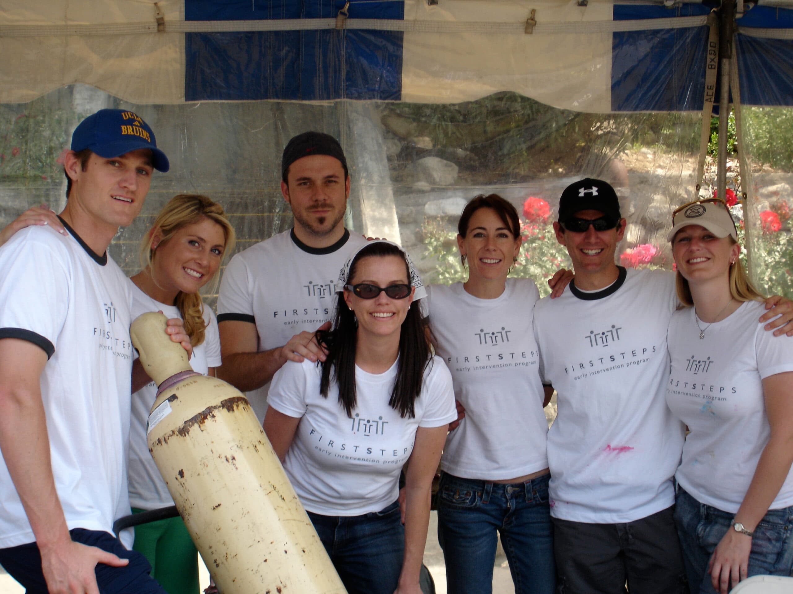 First step staff grouped outside smiling.